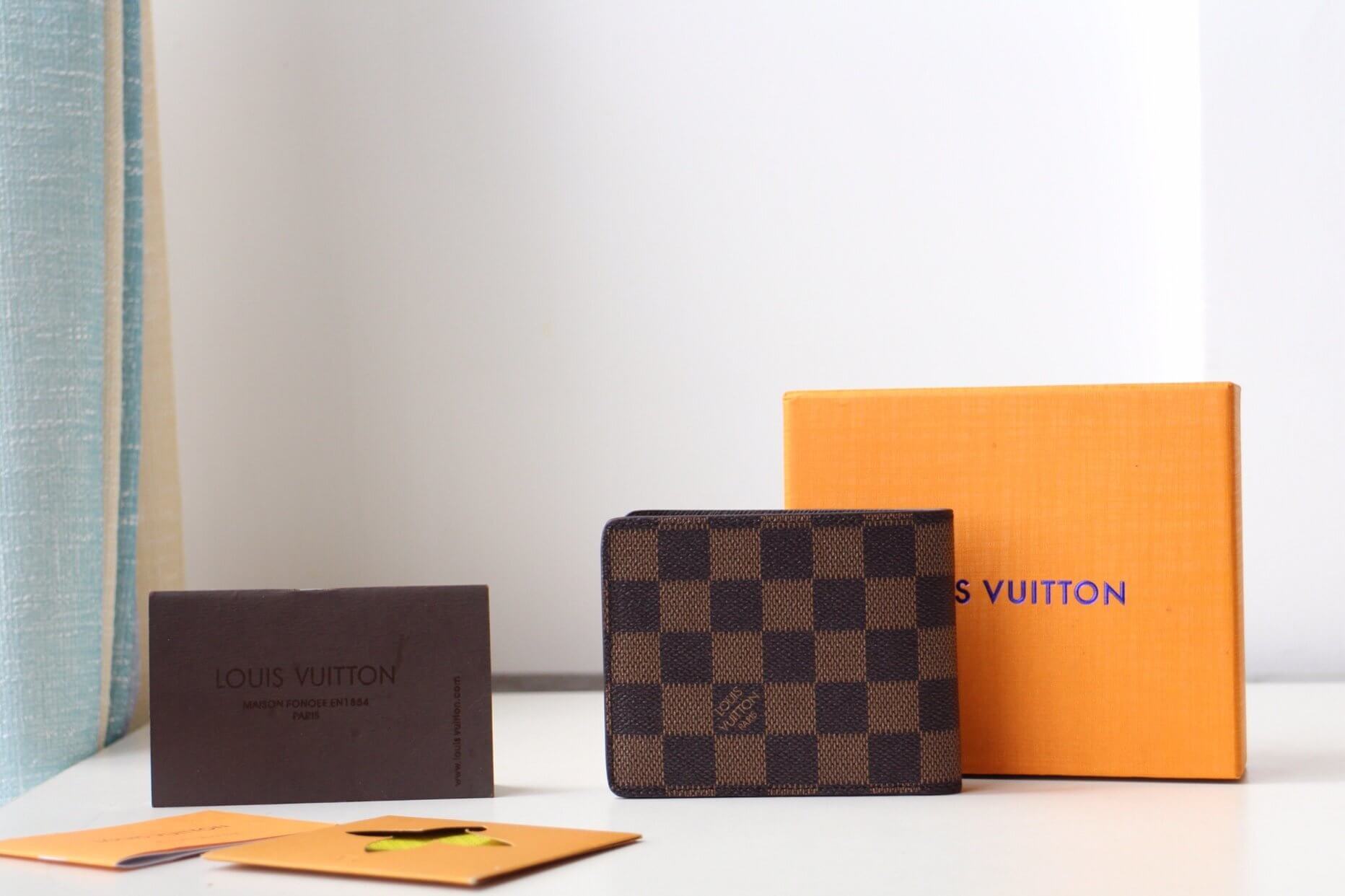 Louis Vuitton LV Damier Ebene Canvas Multiple Wallet N62663 Brown